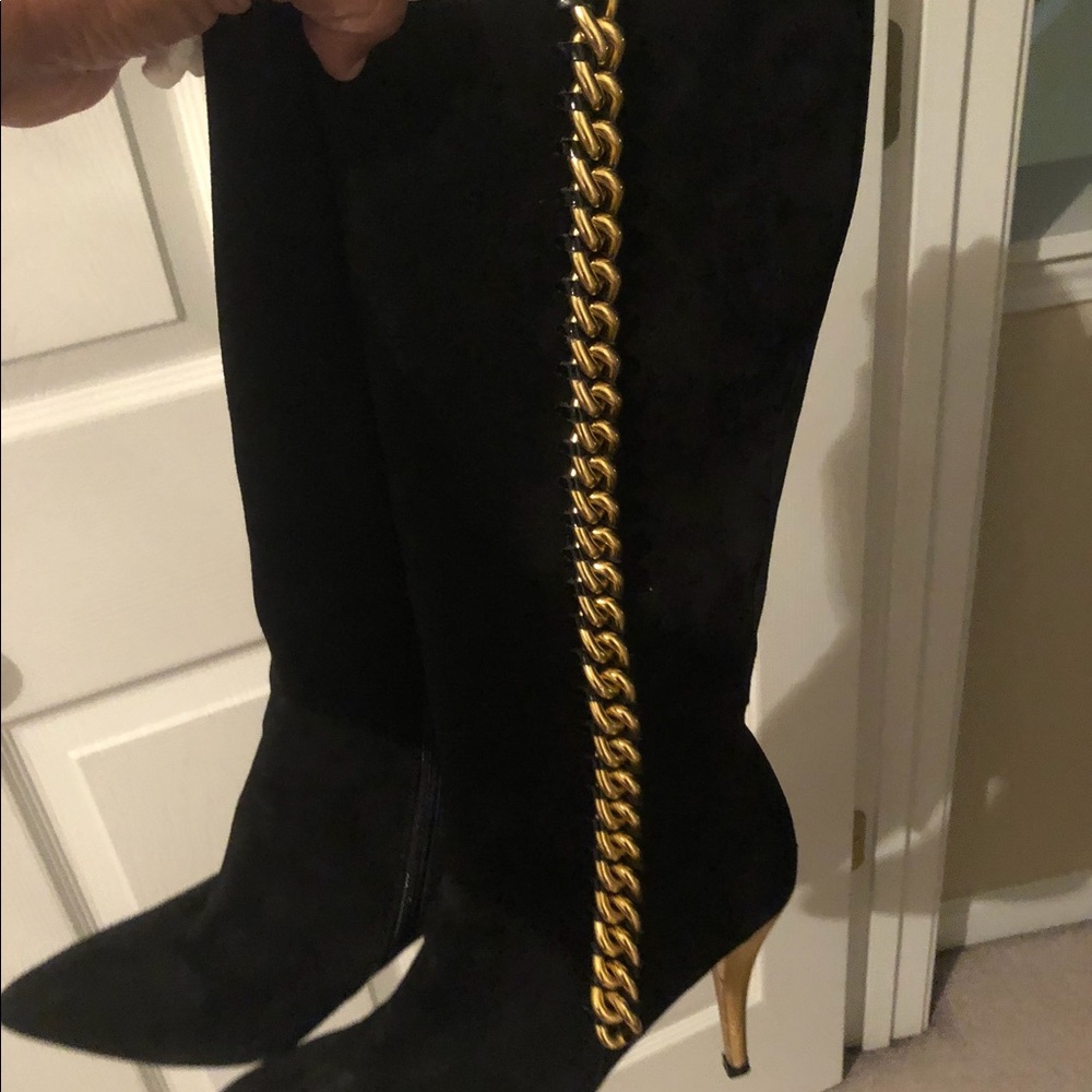 A Pair of Black and Metallic boot